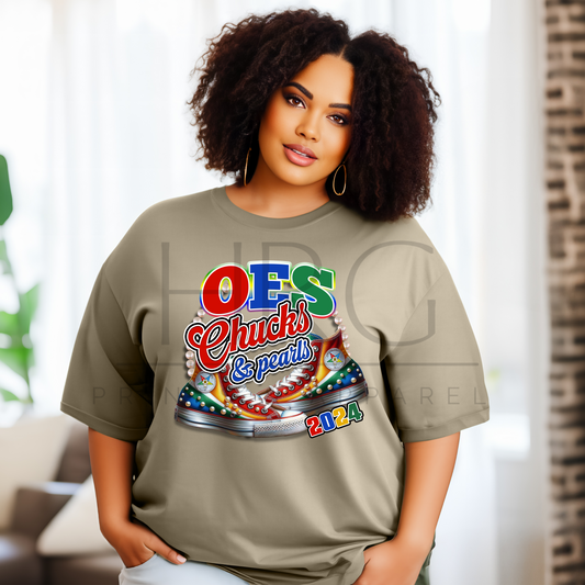 "OES Chucks & Pearls 2024 t-shirt with colorful Eastern Star design worn by a woman."